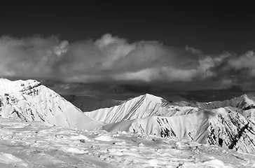 Image showing Black and white view on ski slope and beautiful snowy mountains 