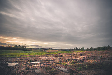 Image showing Landscape with wheel tracks on a muddy field