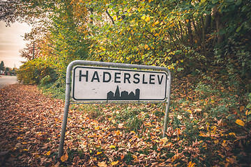 Image showing Haderslev city sign by a road in Denmark