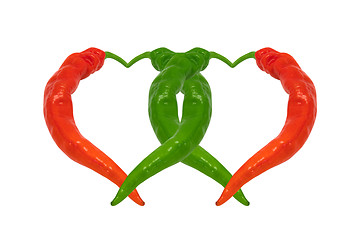 Image showing Red and green chili peppers in love. Hearts composed of peppers.