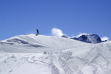 Image showing Snowboarder in terrain park at ski resort on sun winter day