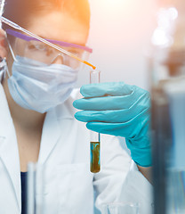 Image showing Young girl carries out tests