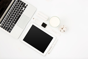 Image showing Top view of white office table with laptop