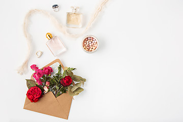 Image showing Love or valentine\'s day concept. Red beautiful roses in envelopen