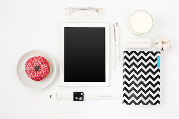 Image showing Top view of white office table with laptop