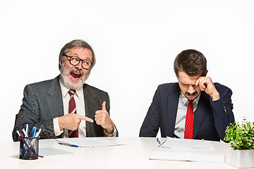 Image showing The two colleagues working together at office on white background.