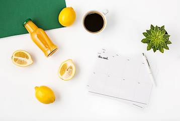 Image showing Top view of white office female workspace with notebook