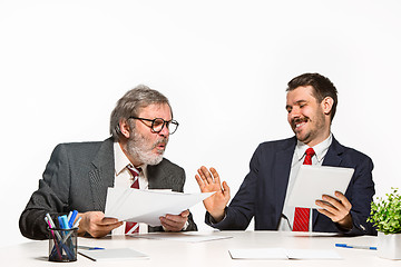 Image showing The two colleagues working together at office on white background.