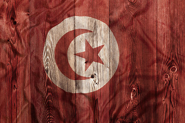 Image showing National flag of Tunisia, wooden background