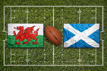 Image showing Wales vs. Scotland flags on rugby field