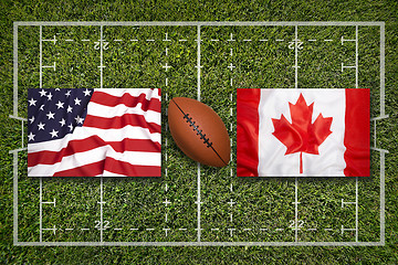 Image showing USA vs. Canada flags on rugby field