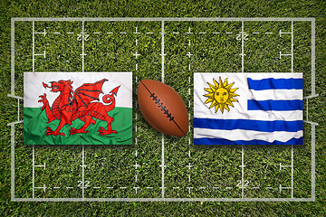 Image showing Wales vs. Uruguay flags on rugby field