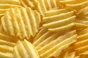 Image showing Background from appetizing corrugated potato chips