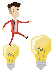 Image showing Businessman jumping on light bulbs.