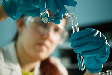 Image showing Lab assistant conducting chemical tests