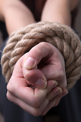 Image showing Tied rope hands of woman