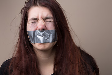 Image showing Girl with tape on face