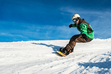 Image showing Snowboard freerider in the mountains