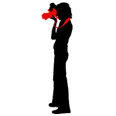 Image showing Cameraman with video camera. Silhouettes on white background. illustration