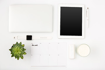 Image showing Top view of white office table with laptop