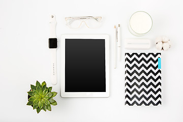 Image showing Top view of white office table with laptop