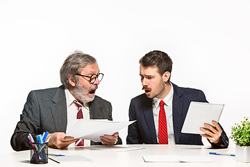 Image showing The two colleagues working together at office on white background.