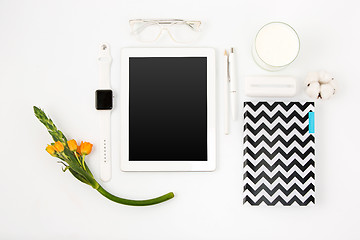 Image showing Top view of white office table with laptop