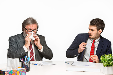 Image showing The two colleagues working together at office on white background.