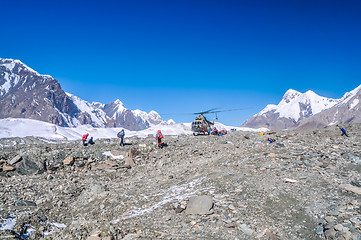 Image showing Helicopter and mountains