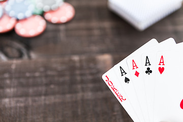 Image showing Cards and poker chips on wooden background