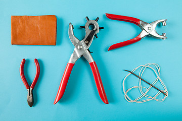 Image showing Working tools leather craftsman top views