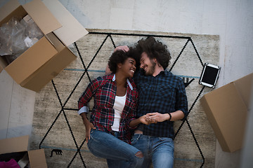 Image showing Top view of attractive young multiethnic couple