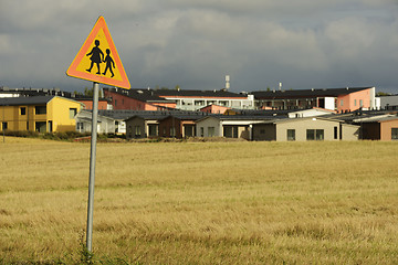 Image showing road sign caution children against the village