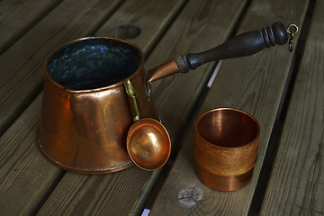 Image showing set of copper cookware coffee on wooden table