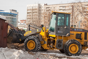 Image showing Tractor on demolition of wooden houses quarter