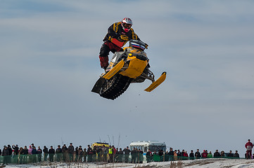 Image showing High jump of sportsman on snowmobile