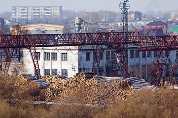 Image showing pile of wood logs on plywood combine. Tyumen