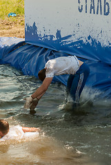 Image showing Man with girl jump in water in extrim racing