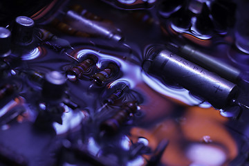 Image showing vintage circuit board with dark red and blue reflection