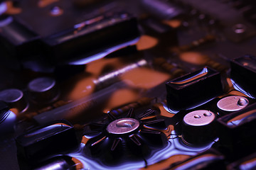 Image showing vintage circuit board with red and blue reflection