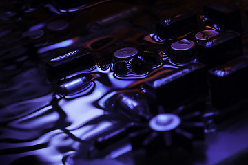 Image showing vintage circuit board with blue and red reflection