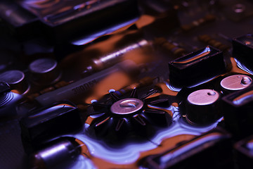 Image showing vintage circuit board with red and blue reflection