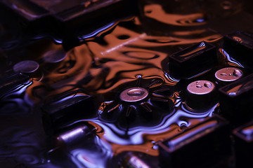 Image showing vintage circuit board with dark red and blue reflection