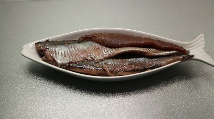 Image showing  fillet salted herring with caviar on a plate