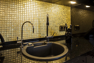 Image showing Kitchen desktop with a sink and faucet