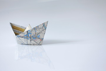 Image showing Paper ship from the map on a white