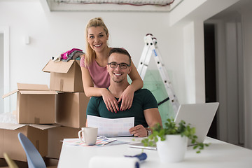 Image showing Young couple moving in a new home