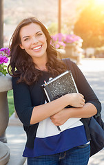 Image showing Portrait of Pretty Young Female Student Carrying Books on School