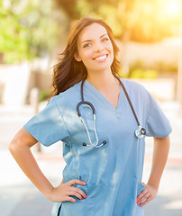 Image showing Portrait of Young Adult Female Doctor or Nurse Wearing Scrubs an