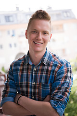 Image showing man standing at balcony